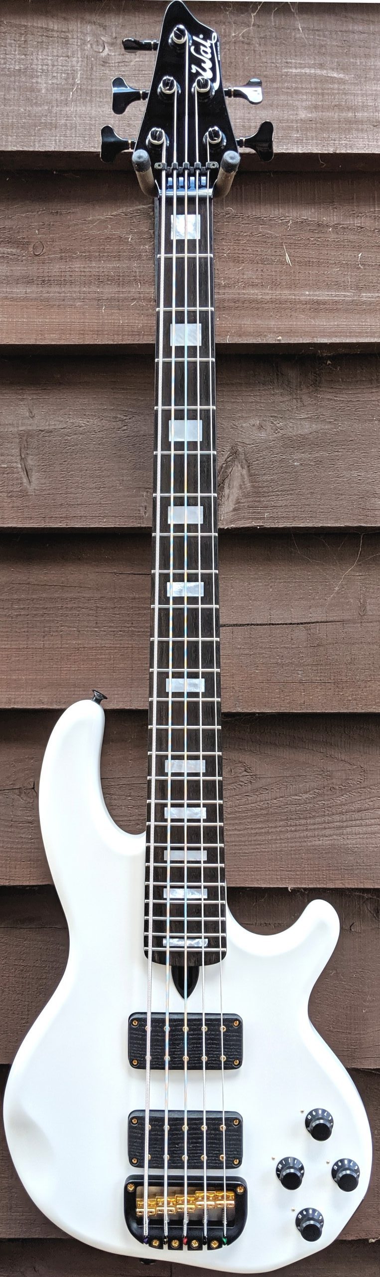 5-string Mk3 with gloss white body, gloss black neck, an ebony fingerboard with MOP block inlays, gold hardware and black tuners & retainer.