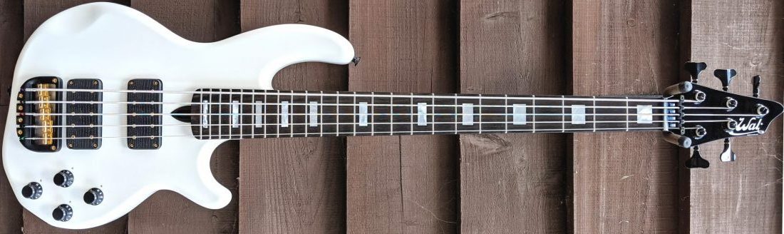5-string Mk3 with gloss white body, gloss black neck, an ebony fingerboard with MOP block inlays, gold hardware and black tuners & retainer.